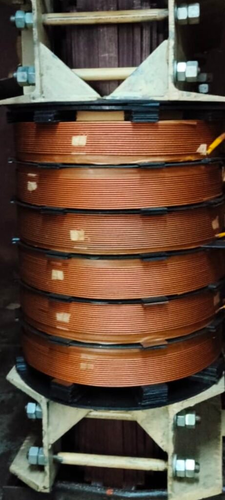 Transformer copper winding coil rewinding work - HT LT transformer core and coil assembly in Kerala